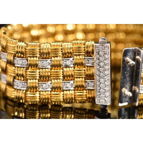 13 - A MODERN 18CT GOLD ROBERTO COIN DIAMOND BRACELET, a wide flat panel link textured pattern with diamo... 