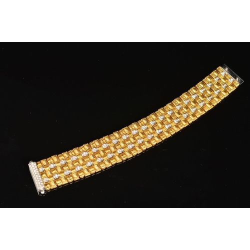 13 - A MODERN 18CT GOLD ROBERTO COIN DIAMOND BRACELET, a wide flat panel link textured pattern with diamo... 