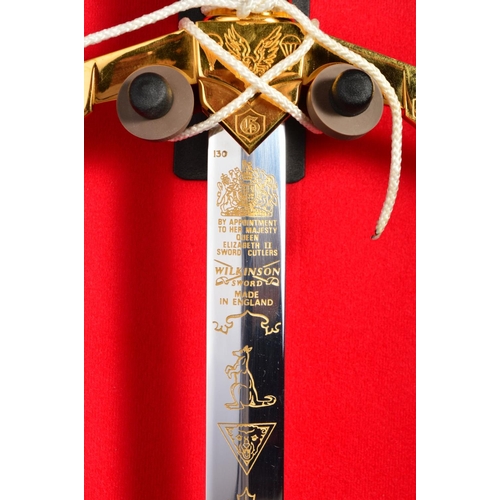 133 - A FINE LIMITED EDITION DISPLAY SWORD, contained in a handmade display case commemorating the 50th An... 