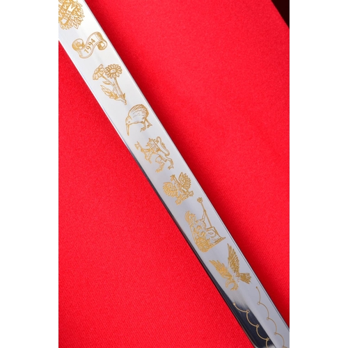 133 - A FINE LIMITED EDITION DISPLAY SWORD, contained in a handmade display case commemorating the 50th An... 