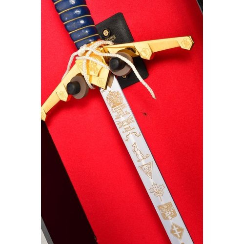 133 - A FINE LIMITED EDITION DISPLAY SWORD, contained in a handmade display case commemorating the 50th An... 