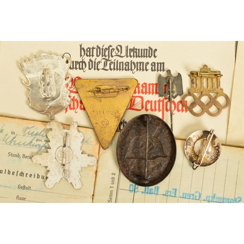 142 - A NUMBER OF GERMAN WWII 3RD REICH MILITARY BADGES AND PAPERWORK, comprising of soldiers 'Soldbuch' 2... 