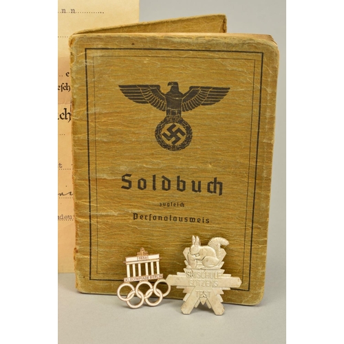 142 - A NUMBER OF GERMAN WWII 3RD REICH MILITARY BADGES AND PAPERWORK, comprising of soldiers 'Soldbuch' 2... 