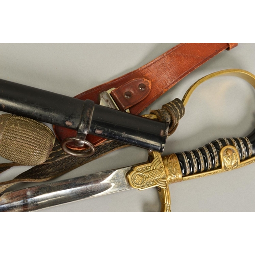 143 - A WWII ERA 3RD REICH OFFICERS SWORD AND SCABBARD, the design is the 'Lions Head' style with red colo... 