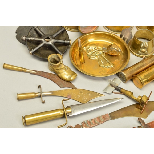 148 - A COLLECTION OF WWI ERA TRENCH ART ITEMS, including shell cases with cut out designs around the rim,... 