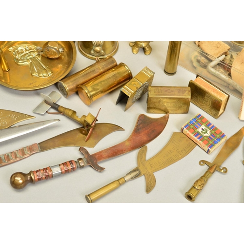 148 - A COLLECTION OF WWI ERA TRENCH ART ITEMS, including shell cases with cut out designs around the rim,... 