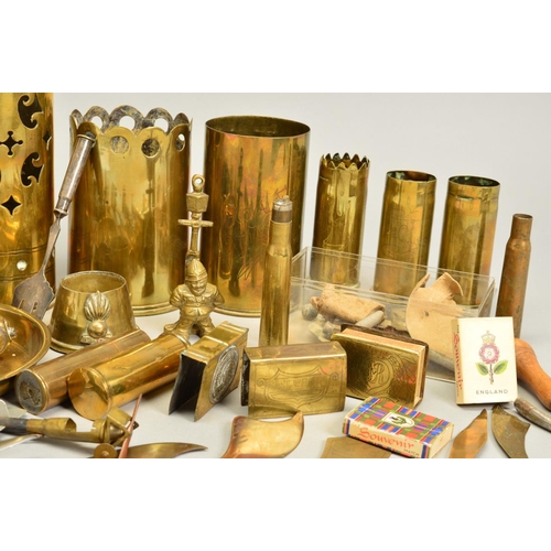 148 - A COLLECTION OF WWI ERA TRENCH ART ITEMS, including shell cases with cut out designs around the rim,... 