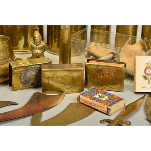 148 - A COLLECTION OF WWI ERA TRENCH ART ITEMS, including shell cases with cut out designs around the rim,... 