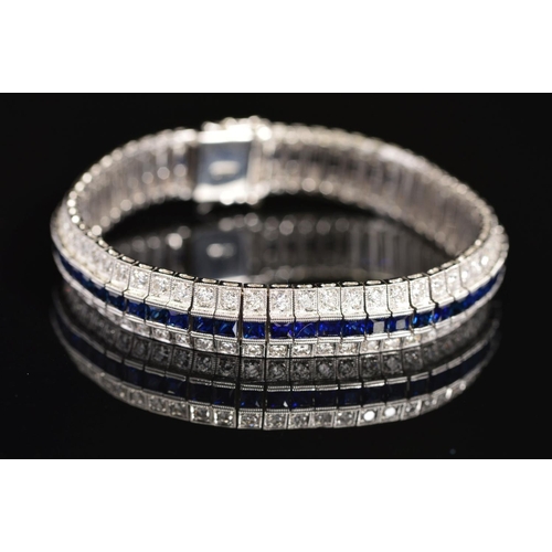 16 - A MODERN SAPPHIRE AND DIAMOND LINE BRACELET, centring on a line of calibre square cut blue sapphires... 