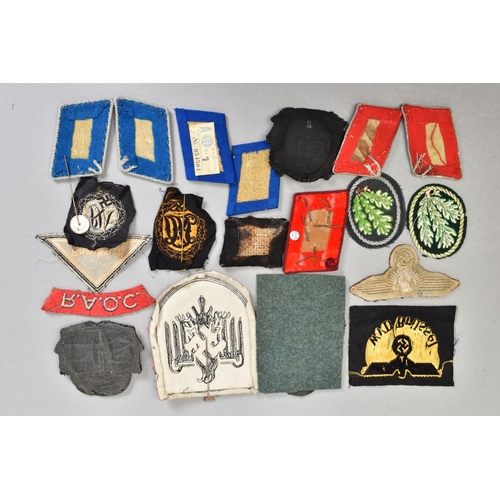 162 - A BOX CONTAINING A NUMBER OF BELIEVED GENUINE GERMAN WWI/WWII CLOTH INSIGNIA, including a large red/... 