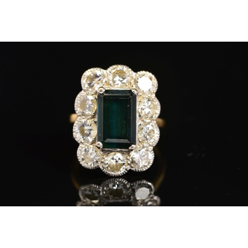 17 - A LARGE 18CT GOLD DIAMOND AND DARK GREEN TOURMALINE CLUSTER RING, emerald cut tourmaline measuring a... 