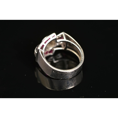 19 - AN EARLY TO MID 20TH CENTURY RUBY AND DIAMOND COCKTAIL RING, centring on an early brilliant cut diam... 