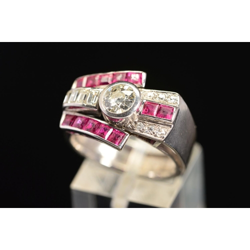 19 - AN EARLY TO MID 20TH CENTURY RUBY AND DIAMOND COCKTAIL RING, centring on an early brilliant cut diam... 