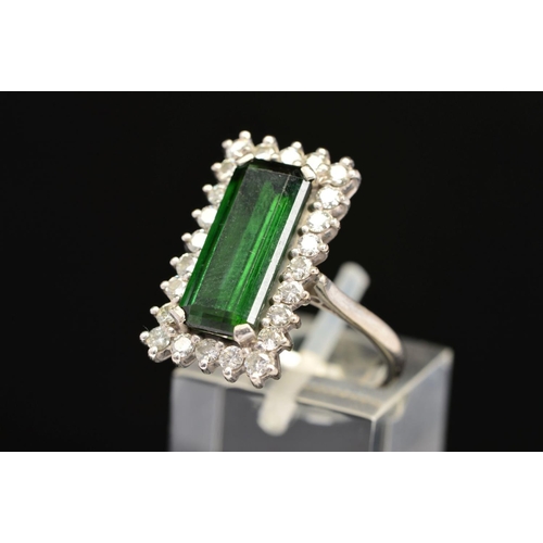 2 - A LATE 20TH CENTURY 18CT GOLD RECTANGULAR SHAPED GREEN TOURMALINE AND DIAMOND CLUSTER RING, an emera... 