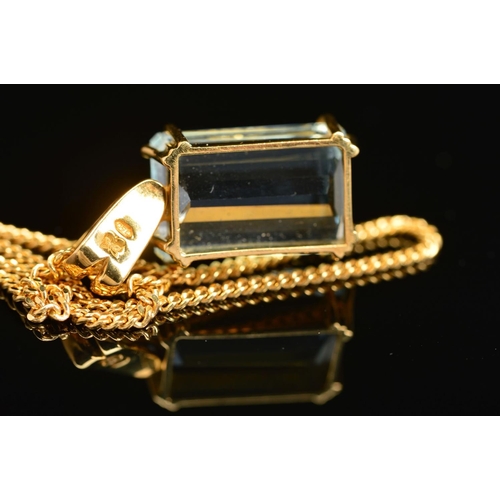 22 - A MODERN 18CT AQUAMARINE PENDANT AND CHAIN, one emerald cut aquamarine measuring 18mm x 11.5mm x 7.9... 