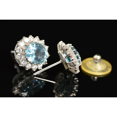 27 - A PAIR OF MODERN OVAL AQUAMARINE AND DIAMOND CLUSTER EARRINGS, post fittings, measuring approximatel... 