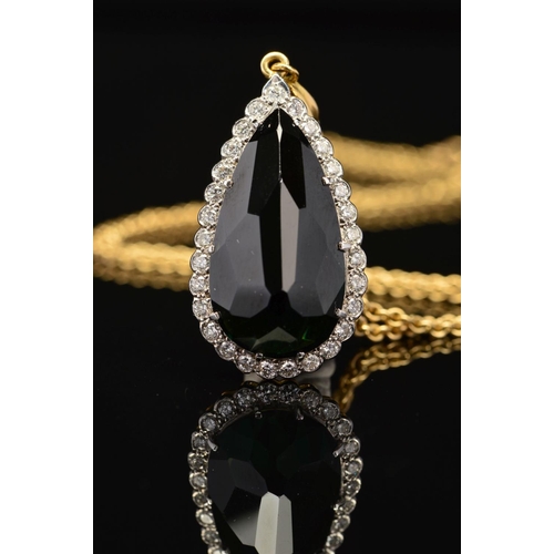 3 - A MODERN 18CT GOLD PEAR SHAPE TOURMALINE AND DIAMOND CLUSTER PENDANT, a dark green tourmaline measur... 