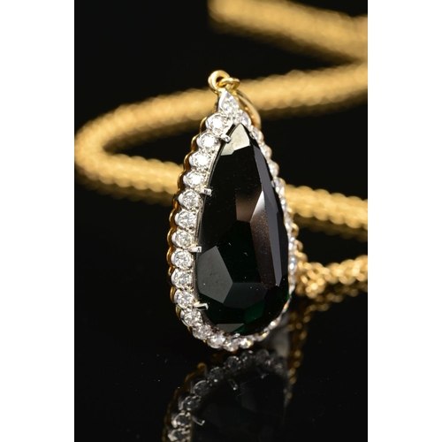 3 - A MODERN 18CT GOLD PEAR SHAPE TOURMALINE AND DIAMOND CLUSTER PENDANT, a dark green tourmaline measur... 