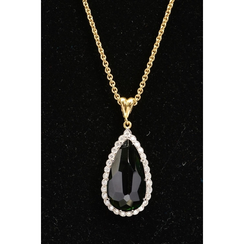 3 - A MODERN 18CT GOLD PEAR SHAPE TOURMALINE AND DIAMOND CLUSTER PENDANT, a dark green tourmaline measur... 