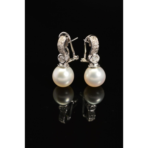 31 - A PAIR OF MODERN 18CT WHITE GOLD SOUTH SEA CULTURED PEARL AND DIAMOND DROP EARRINGS, post and omega ... 