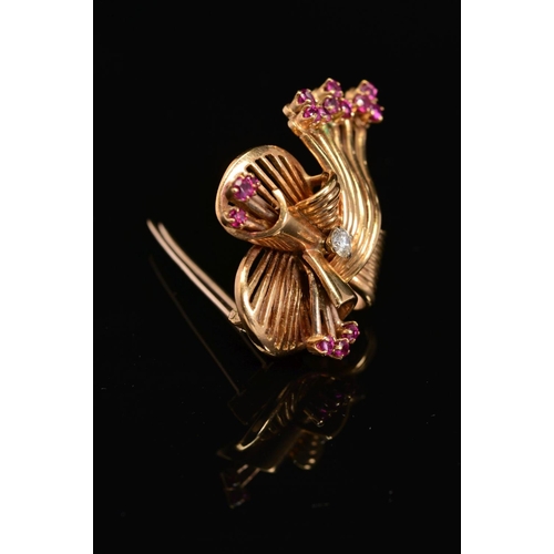 34 - A LATE 20TH CENTURY 18CT GOLD, RUBY AND DIAMOND FAN DESIGN BROOCH, estimated modern round brilliant ... 