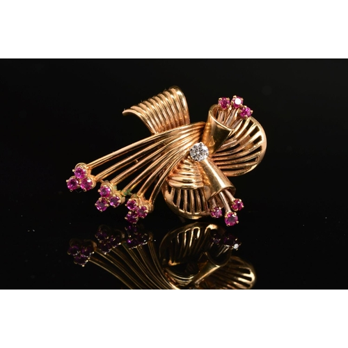 34 - A LATE 20TH CENTURY 18CT GOLD, RUBY AND DIAMOND FAN DESIGN BROOCH, estimated modern round brilliant ... 