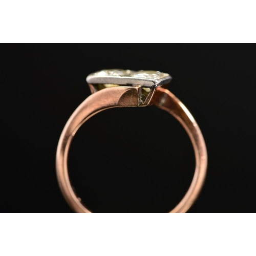 36 - A MID 20TH CENTURY TWO STONE DIAMOND RING, each diamond grain set within a box setting, cross over d... 