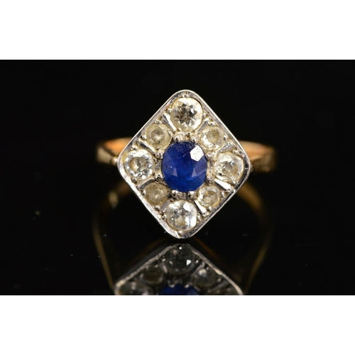 38 - A MID 20TH CENTURY SAPPHIRE AND DIAMOND RING, the central oval sapphire within a surround of eight o... 