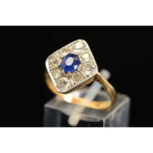 38 - A MID 20TH CENTURY SAPPHIRE AND DIAMOND RING, the central oval sapphire within a surround of eight o... 