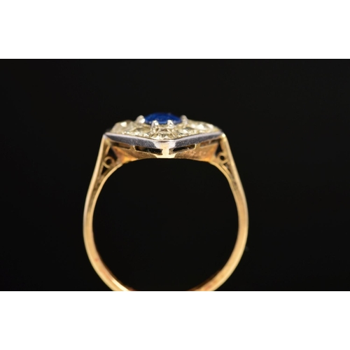 38 - A MID 20TH CENTURY SAPPHIRE AND DIAMOND RING, the central oval sapphire within a surround of eight o... 