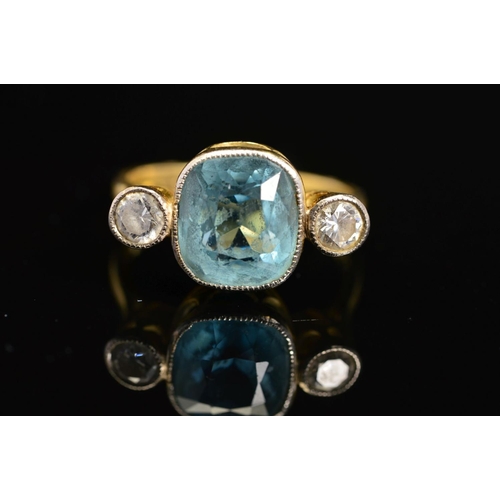 39 - A MID TO LATE 20TH CENTURY AQUAMARINE AND DIAMOND THREE STONE RING, centring on a cushion mixed cut ... 