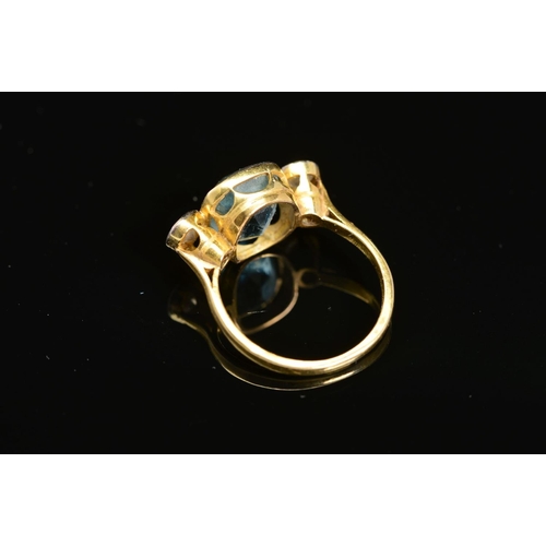 39 - A MID TO LATE 20TH CENTURY AQUAMARINE AND DIAMOND THREE STONE RING, centring on a cushion mixed cut ... 