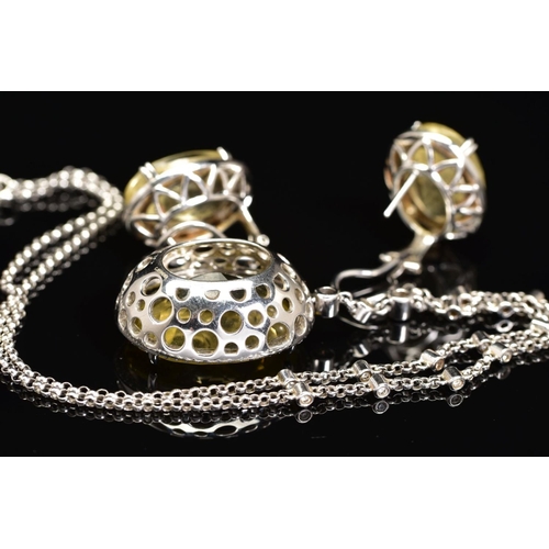 51 - AN 18CT WHITE GOLD, CITRINE AND DIAMOND PENDANT AND MATCHING EARRINGS, the pendant designed as a cen... 