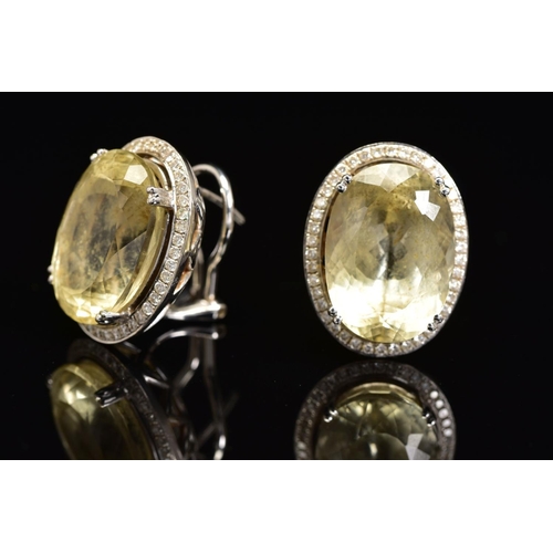 51 - AN 18CT WHITE GOLD, CITRINE AND DIAMOND PENDANT AND MATCHING EARRINGS, the pendant designed as a cen... 