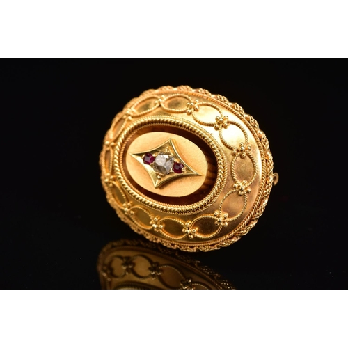 52 - A LATE VICTORIAN GOLD, DIAMOND AND RUBY MEMORIAL BROOCH, of oval outline, the central old cut diamon... 