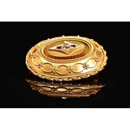 52 - A LATE VICTORIAN GOLD, DIAMOND AND RUBY MEMORIAL BROOCH, of oval outline, the central old cut diamon... 