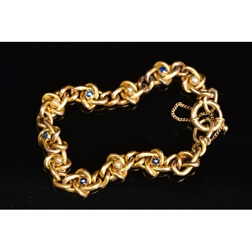 53 - AN EARLY 20TH CENTURY GOLD, SAPPHIRE AND SEED PEARL BRACELET, designed as a twisted curb link bracel... 