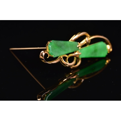 54 - A JADE BROOCH, of horizontal organic design, set with two kite shape jade panels as abstract flower ... 