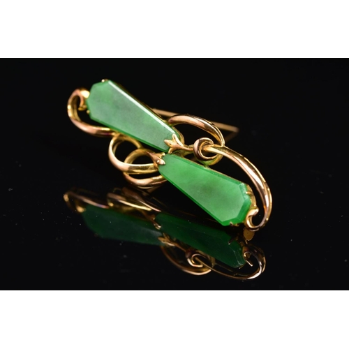 54 - A JADE BROOCH, of horizontal organic design, set with two kite shape jade panels as abstract flower ... 