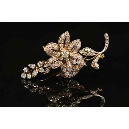 56 - A VICTORIAN GOLD, DIAMOND FLORAL AND FOLIATE BROOCH, mounted en tremblant, the centre flower mounted... 