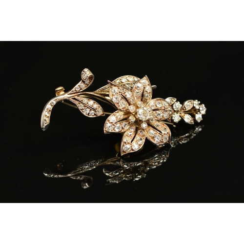 56 - A VICTORIAN GOLD, DIAMOND FLORAL AND FOLIATE BROOCH, mounted en tremblant, the centre flower mounted... 