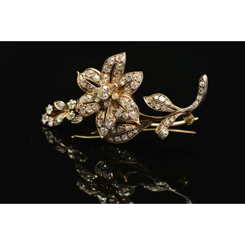 56 - A VICTORIAN GOLD, DIAMOND FLORAL AND FOLIATE BROOCH, mounted en tremblant, the centre flower mounted... 