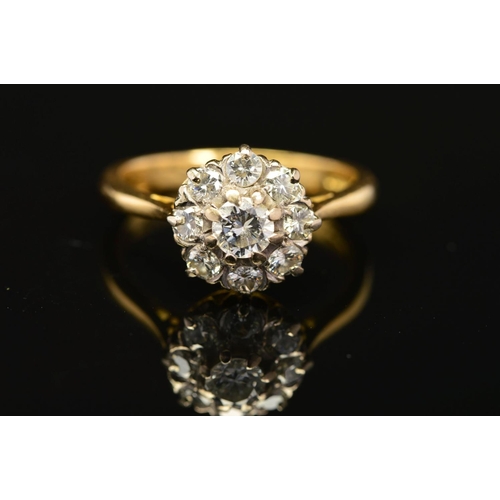 6 - A MODERN ROUND BRILLIANT DIAMOND CLUSTER RING, estimated total diamond weight 0.99ct, ring size R 1/... 