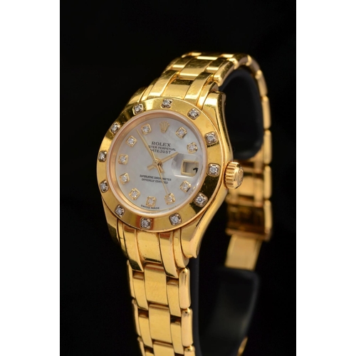 64 - A LADIES 18CT GOLD ROLEX OYSTER PERPETUAL PEARLMASTER WRISTWATCH, 28mm mother of pearl diamond dot d... 