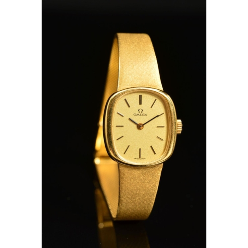 65 - A LADIES OMEGA CUSHION SHAPED MECHANICAL WRISTWATCH, champagne dial with gold coloured batons, hand ... 