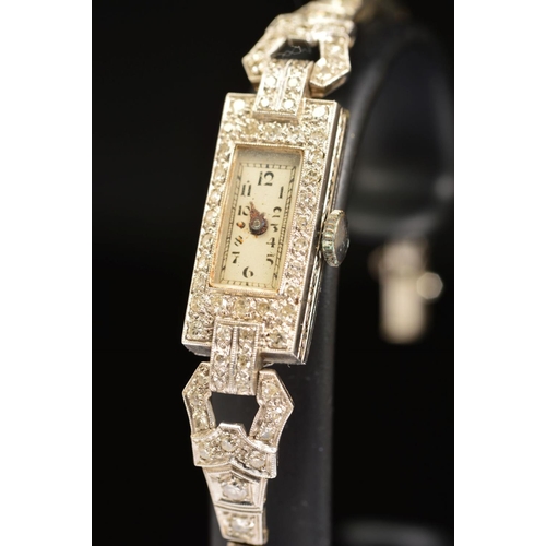 72 - AN EARLY 20TH CENTURY DIAMOND COCKTAIL WATCH, rectangular shaped case, measuring 22mm x 10.1mm, esti... 