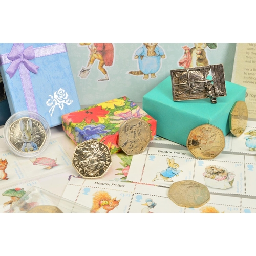 79 - A BOX CONTAINING ROYAL MINT AND BEATRIX POTTER RELATED  ITEMS, to include six Royal Mint packs of fi... 