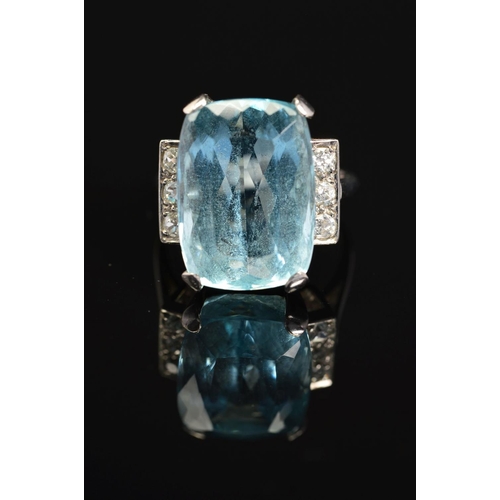 8 - AN ART DECO AQUAMARINE AND DIAMOND RING, centring on a rectangular cut aquamarine measuring approxim... 