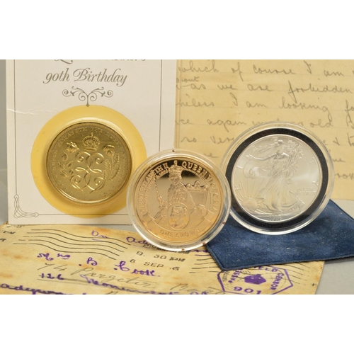 80 - A SMALL PACKAGE OF COINS, to include a Royal Mint sealed Millennium gold half sovereign and a 1996 W... 