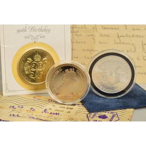 80 - A SMALL PACKAGE OF COINS, to include a Royal Mint sealed Millennium gold half sovereign and a 1996 W... 